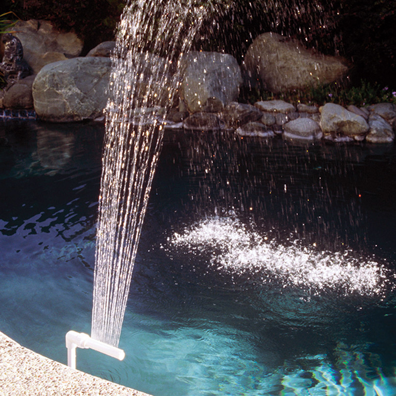 inground spa with waterfall